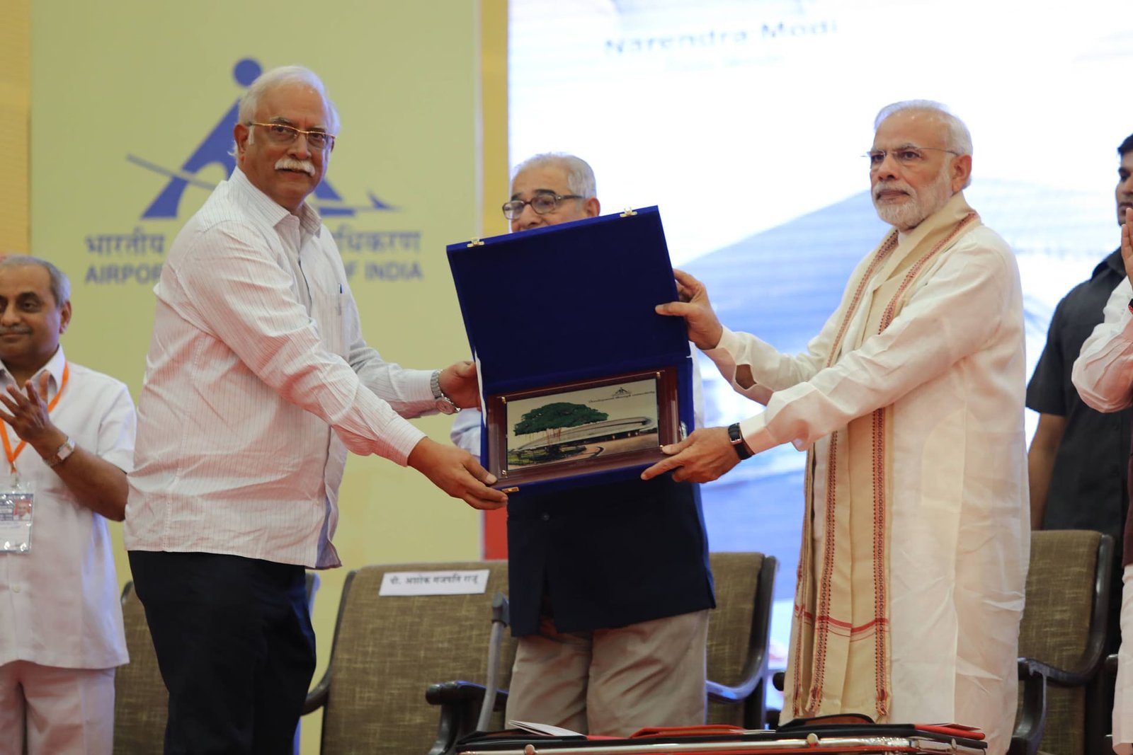 Prime Minister Narendra Modi receiving a memento at the Vadodara airport terminal inauguration